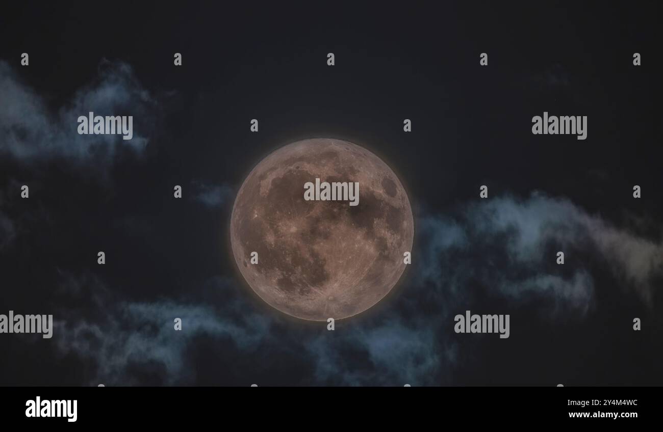 Full moon in the sky among the clouds Stock Photo - Alamy
