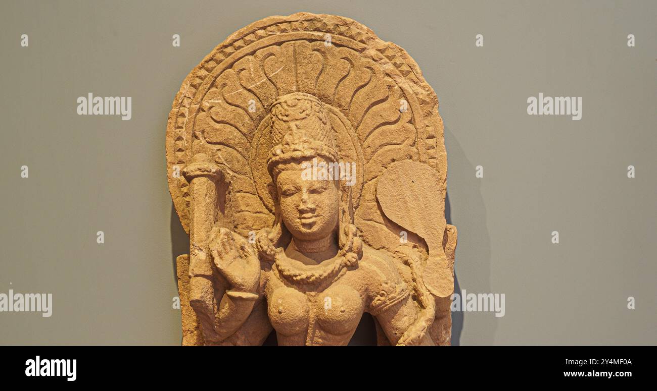 Ancient Statue Of Dancing Vaishnavi - Shakti Of Preserver-god Shri Vishnu. She Holds Shankha conch , Chakra discus . One Of Matrikas, Group Of Seven Stock Photo