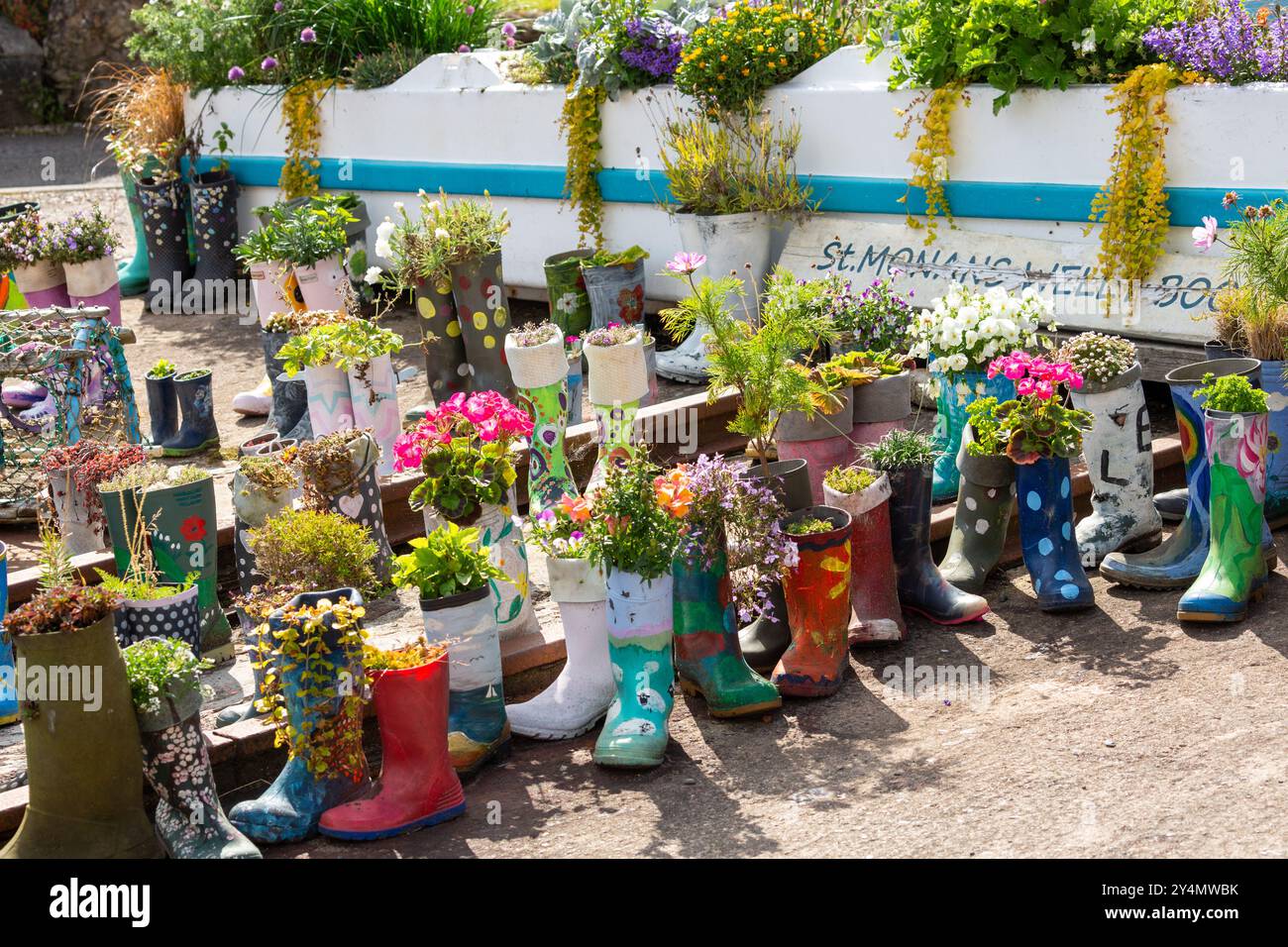 Planted flowers in boots hi-res stock photography and images - Alamy