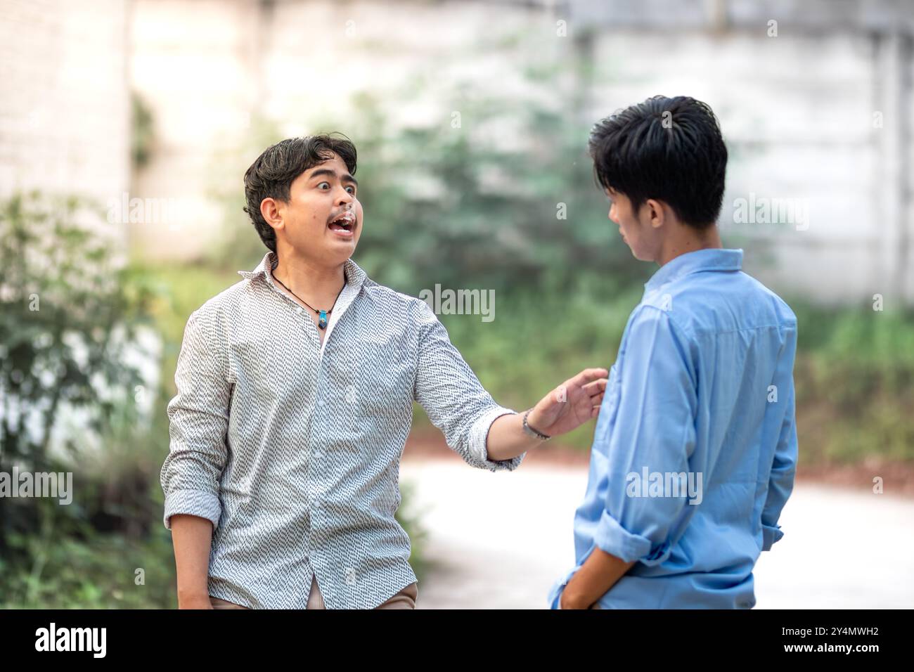 Conflict between people, Friction in friendship. A man having a disagreement with his friend. Dispute in relationship Stock Photo