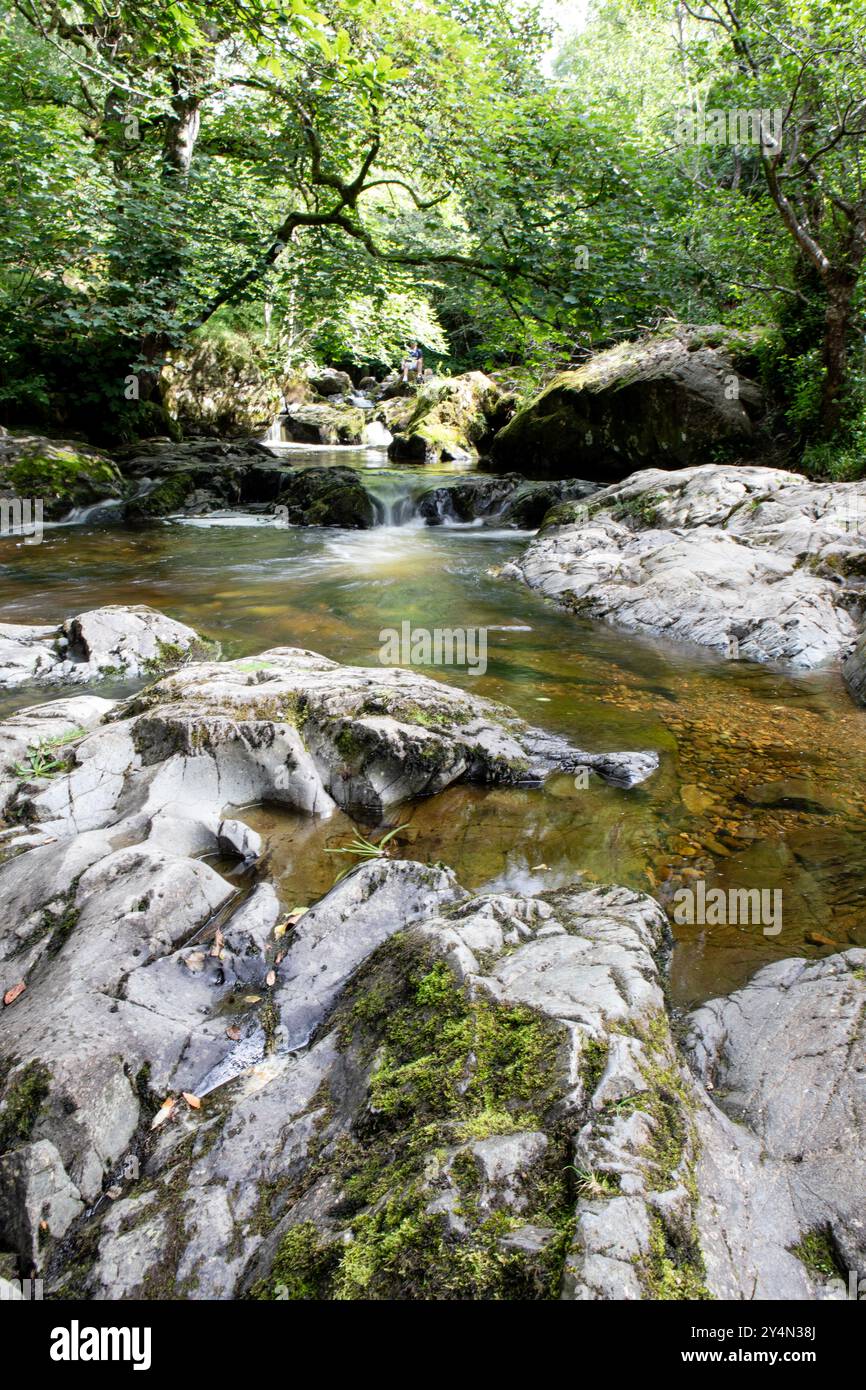 Shallow pools amidst the rocks at the bottom of Aira force water fall in Lake district. Stock Photo