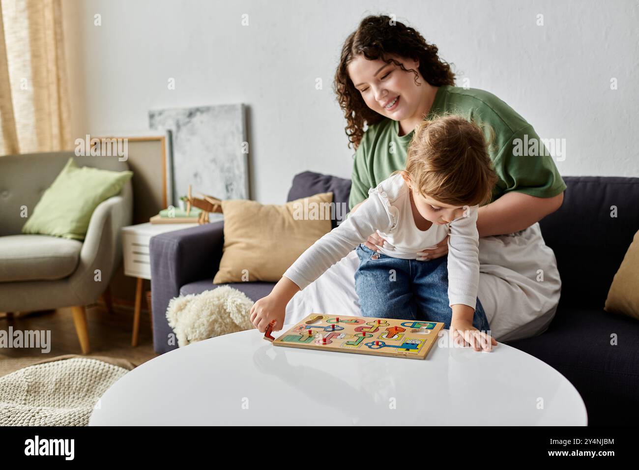Joyful family interaction unfolds hi-res stock photography and images ...