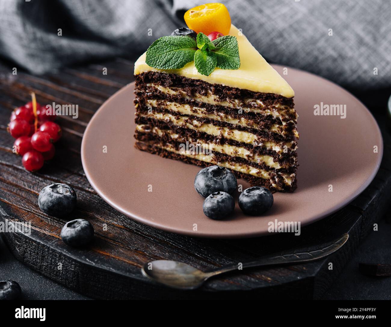 chocolate vanilla cake with berries on plate Stock Photo - Alamy