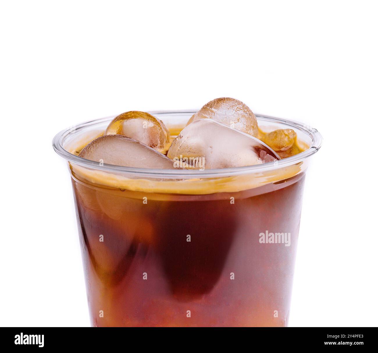 Cola with ice in plastic glass on white background Stock Photo - Alamy