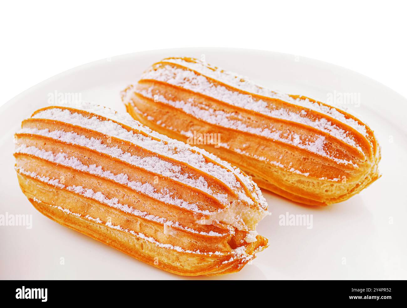 two eclairs on white plate isolated Stock Photo