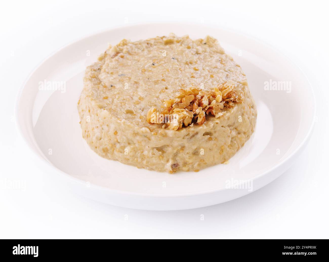 Oatmeal porrige in white plate isolated Stock Photo