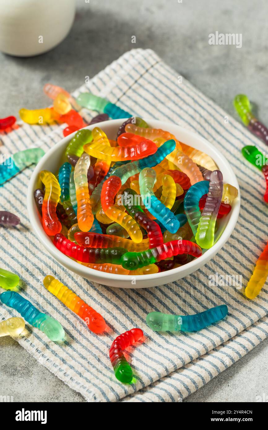 Sweet Sugary Gummy Worms for Halloween in a Bowl Stock Photo
