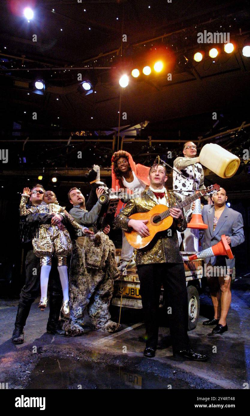 the Mechanicals, l-r: Toby Hadoke (Snout), Franky Mwangi (Changeling Boy),  Howard Chadwick (Snug), Chris Jackson (Flute), Francis Magee (Quince),  Tom Hodgkins (Bottom), Trevor Dwyer-Lynch (Starveling) in A MIDSUMMER NIGHT'S DREAM by Shakespeare at the Royal Exchange Theatre, Manchester, England  11/03/2002  design: Rae Smith  lighting: Jon Buswell  fights: Renny Krupinski  choreographer: Leah Hausman  director: Lucy Bailey Stock Photo