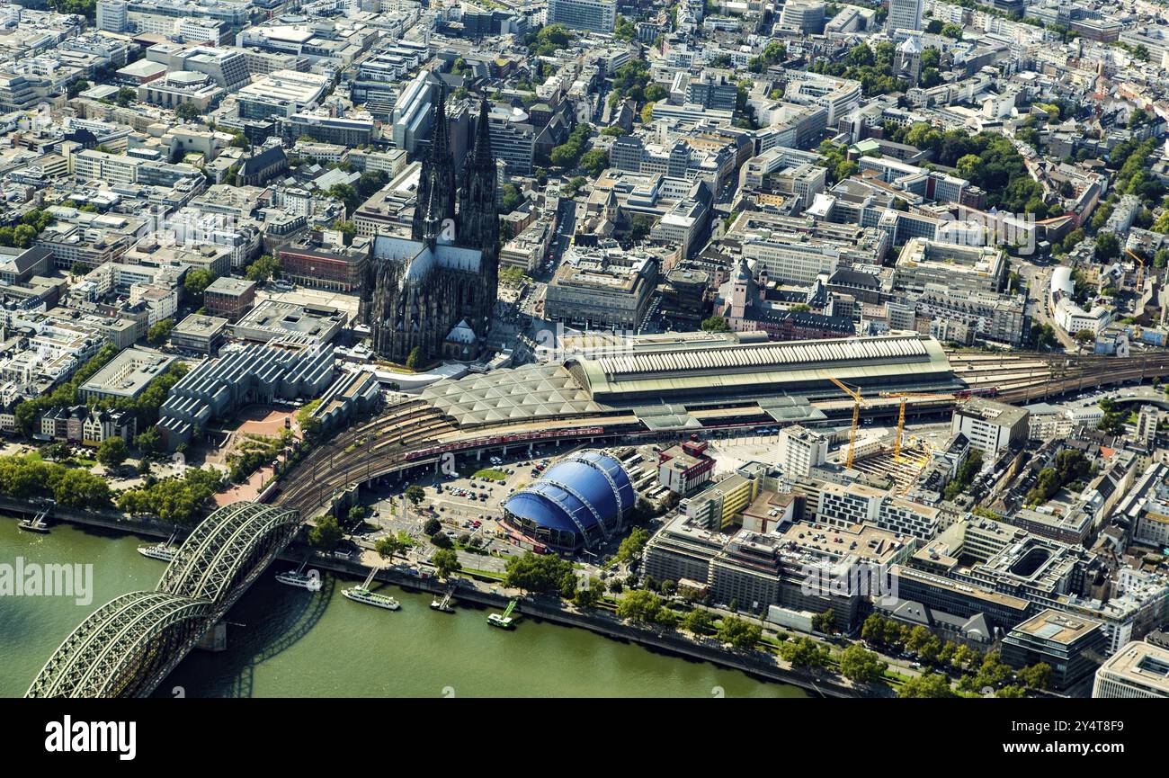 Germany, Cologne Cathedral with main railway station and Domplatte. Rhineland. North Rhine-Westphalia, Europe Stock Photo