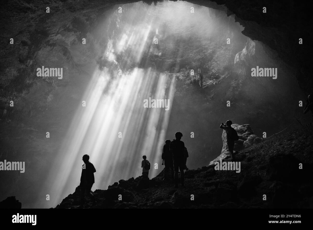 Light from the top of Jomblang Cave in Java island, Indonesia (black and white) Stock Photo