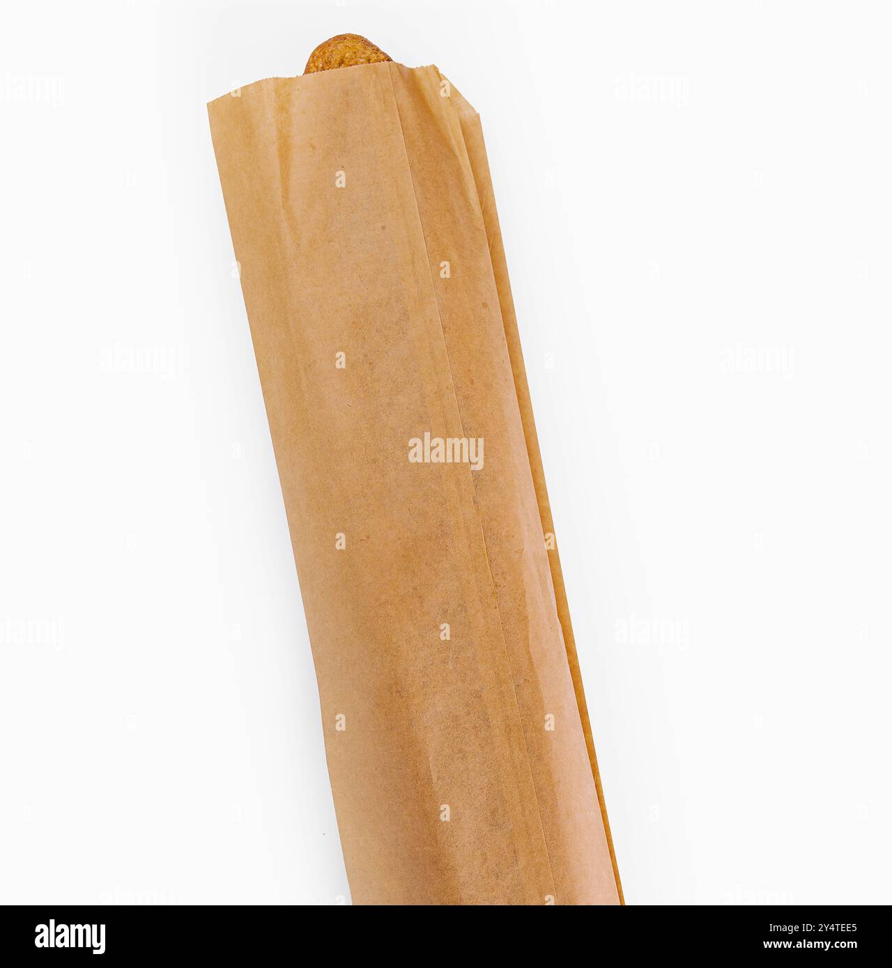 Delicious fresh baguette peeking out of a brown paper bag, isolated on ...