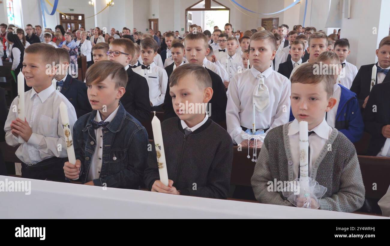 Lida, Belarus - June 15, 2021: Children holding candles during their ...