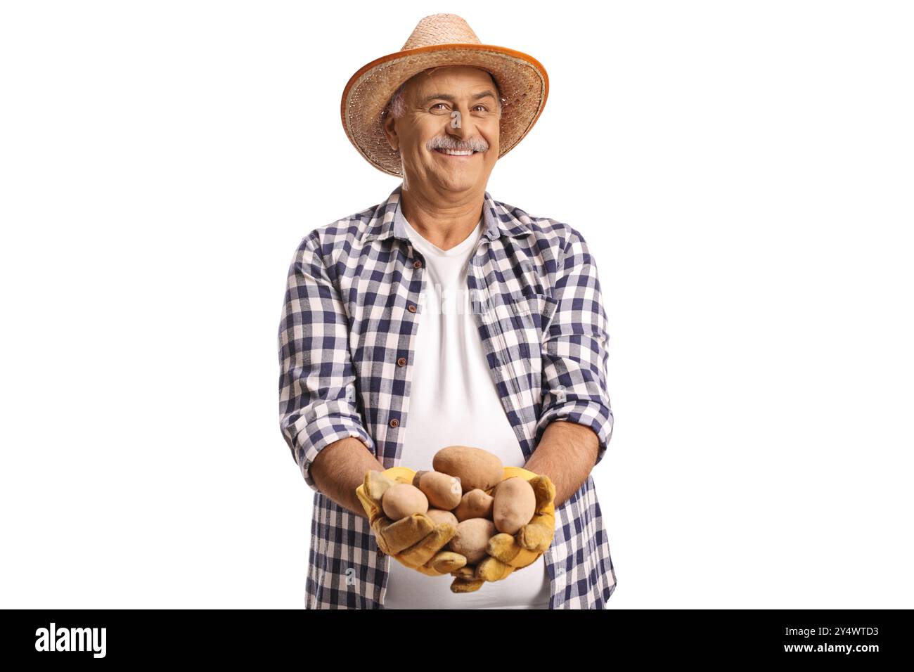 Smiling farmer holding potatoes in his hands isolated on white background Stock Photo