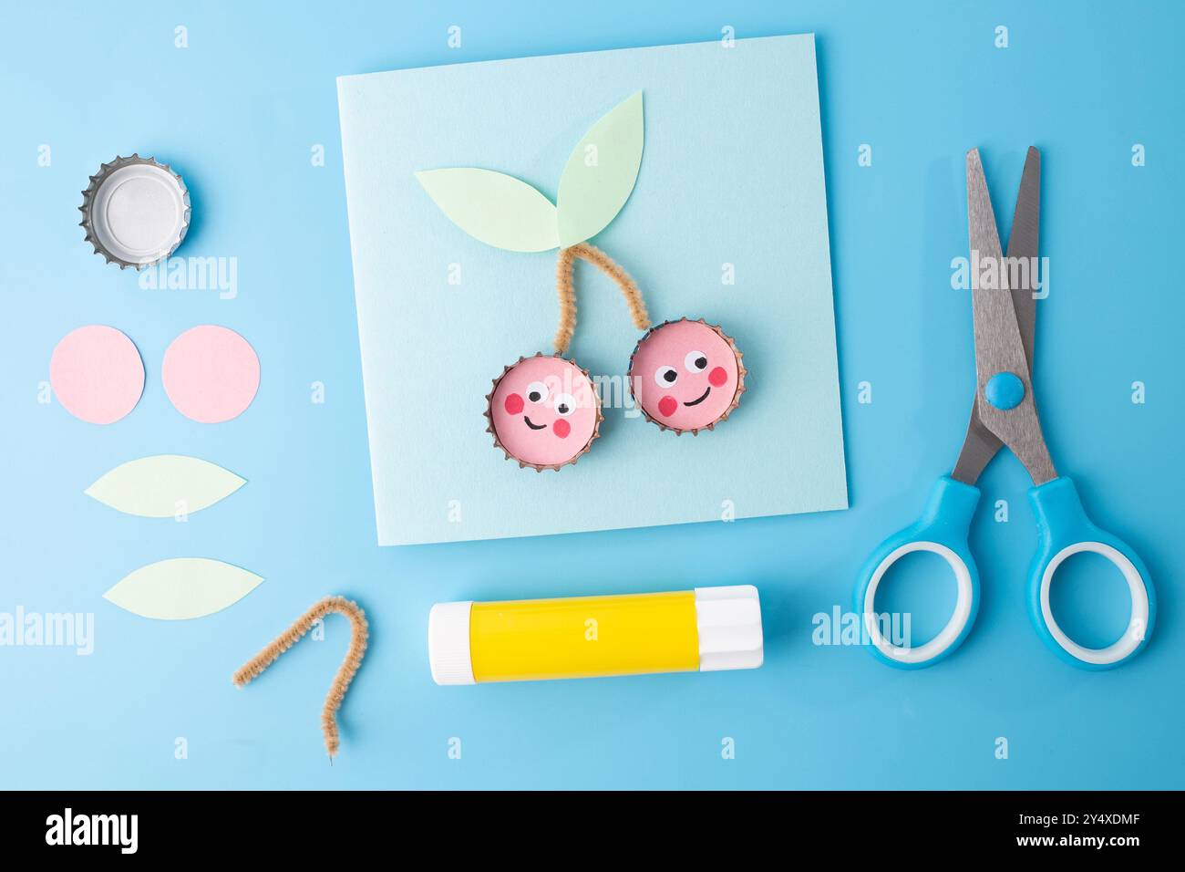 Childs craft project with scissors on paper, showcasing a cherry themed ...