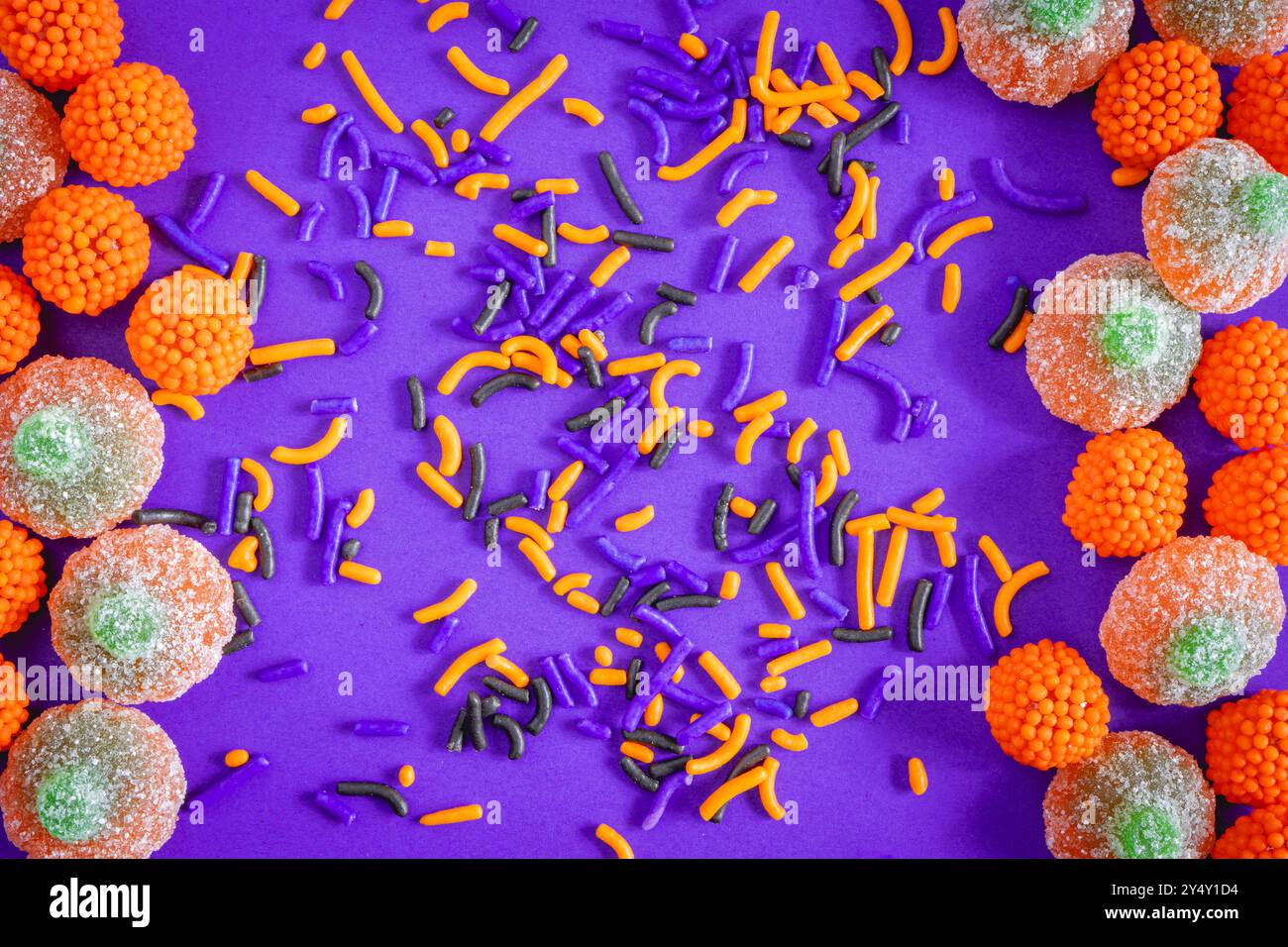 Halloween candy on a purple background,. Halloween sweets. Stock Photo