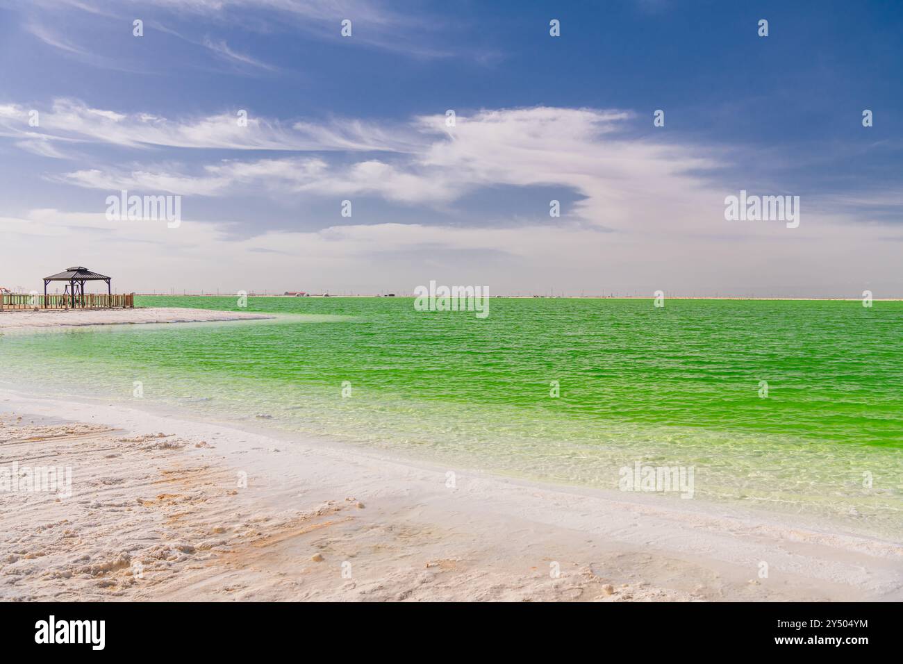 The green saline lake and beach pavilion, natural lake background. Blue sky with copy space for text Stock Photo