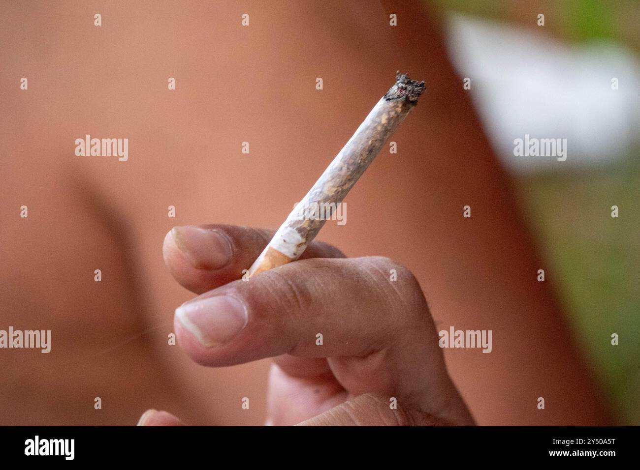 a cigarette pressed between her lips Close Young Man Cigarette Between Lips a cigarette pressed between her lips Close Young Man Cigarette Between Lips