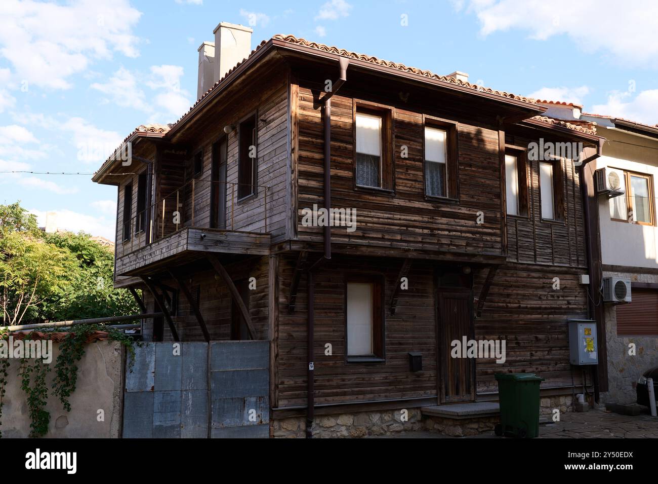 Traditional wooden architecture stands in a historic neighborhood under ...