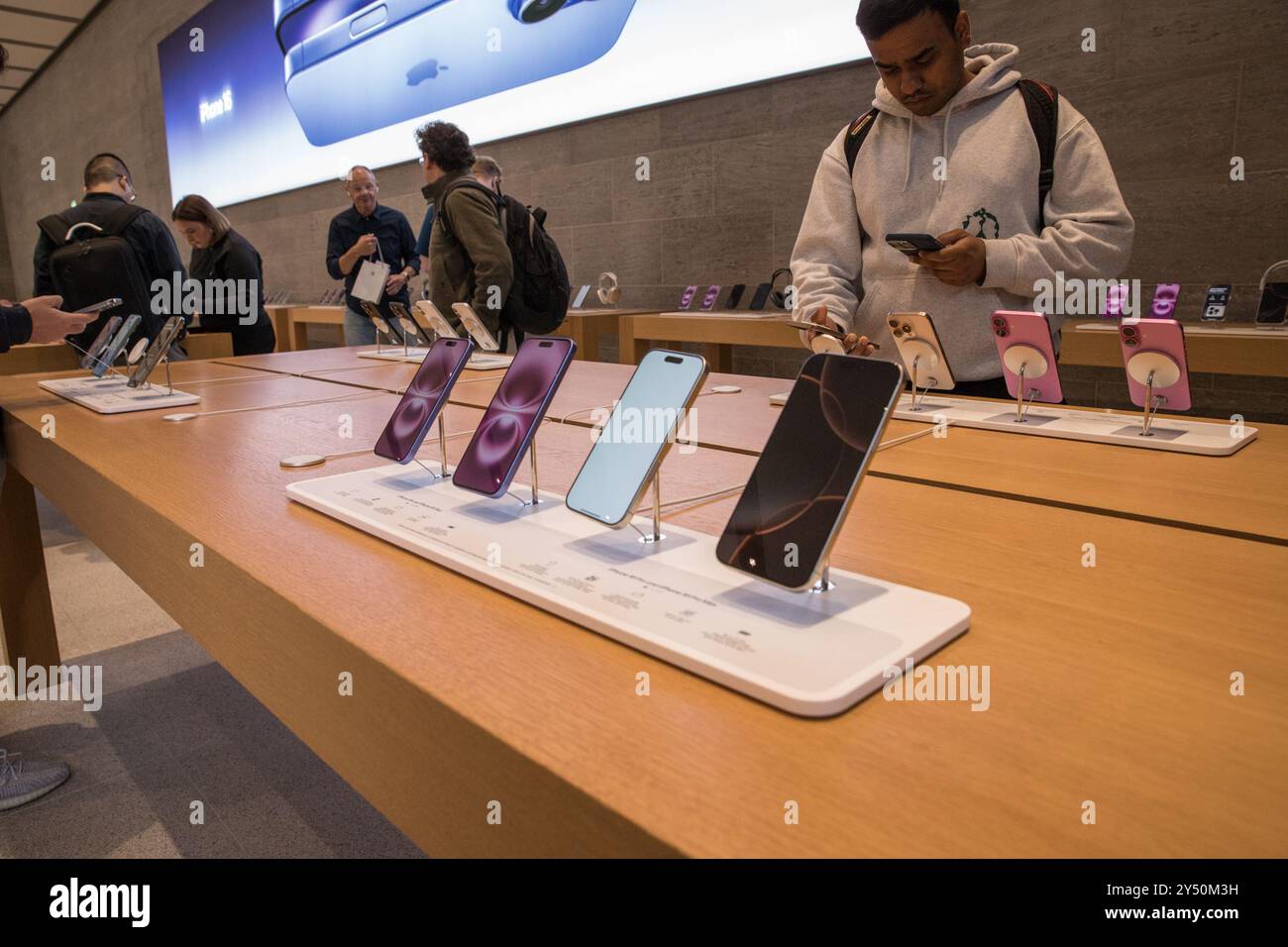 Berlin, Germany. 20th Sep, 2024. Dozens of eager consumers lined up outside the Apple Store on Kurfuerstendamm in Berlin early Friday morning, September 20, 2024, awaiting the release of Apple's highly anticipated new products, including the iPhone 16 lineup, the Apple Watch Series 10, and updated AirPods.Some customers began camping outside the store as early as Thursday afternoon, driven by excitement for the next generation of Apple's technology. The iPhone 16, which includes the base model, the iPhone 16 Plus, and the premium iPhone 16 Pro and Pro Max versions, has garnered widespread Stock Photo