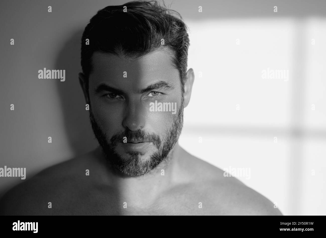 Satisfied man touching face beard Black and White Stock Photos & Images ...
