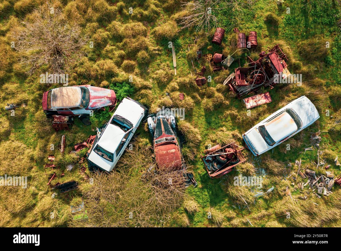 Aerial view of car wrecks in a paddock with overgrown vegetation at Guildford in central Victoria, Australia. Stock Photo