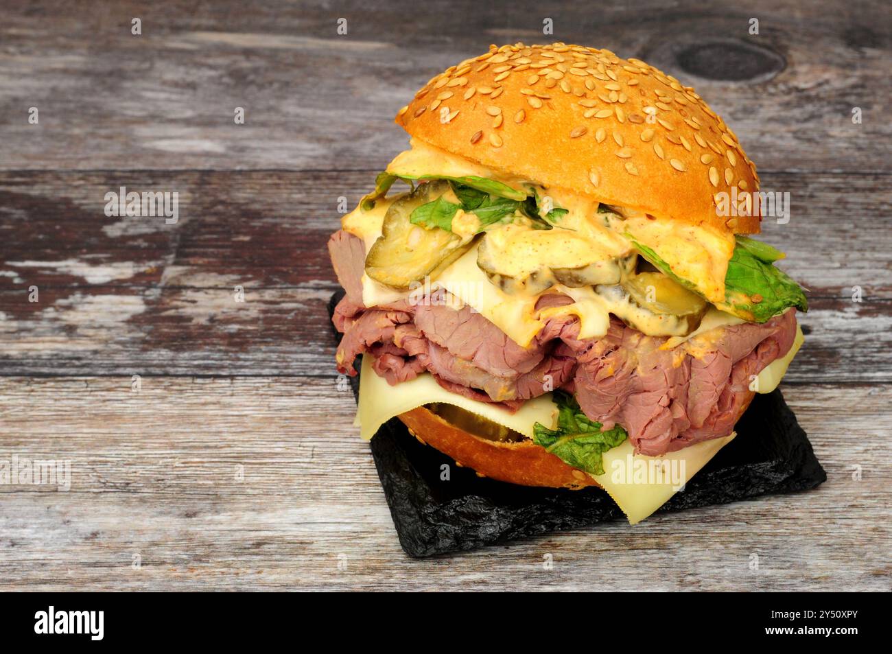 Roast beef sandwich roll with burger sauce, Emmental cheese and lettuce ...