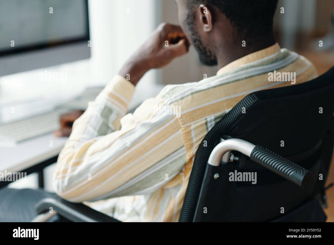 Man With Disability Working On Computer Stock Photo