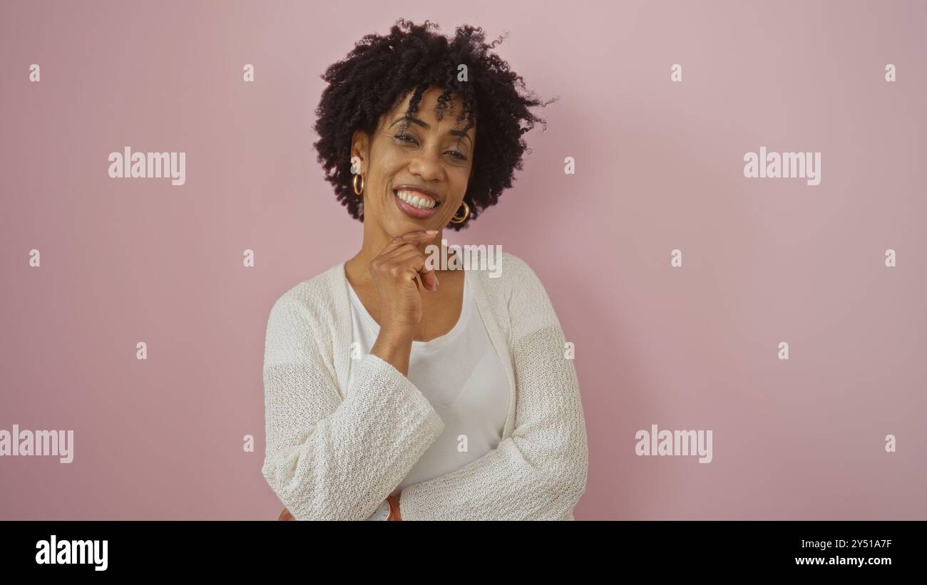 A beautiful young african american woman with curly hair posing ...