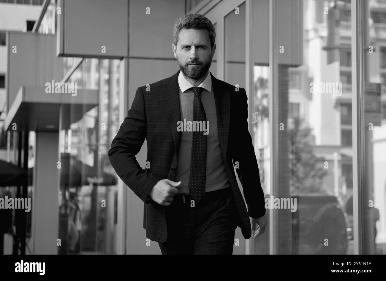 Handsome middle aged man walking Black and White Stock Photos & Images ...