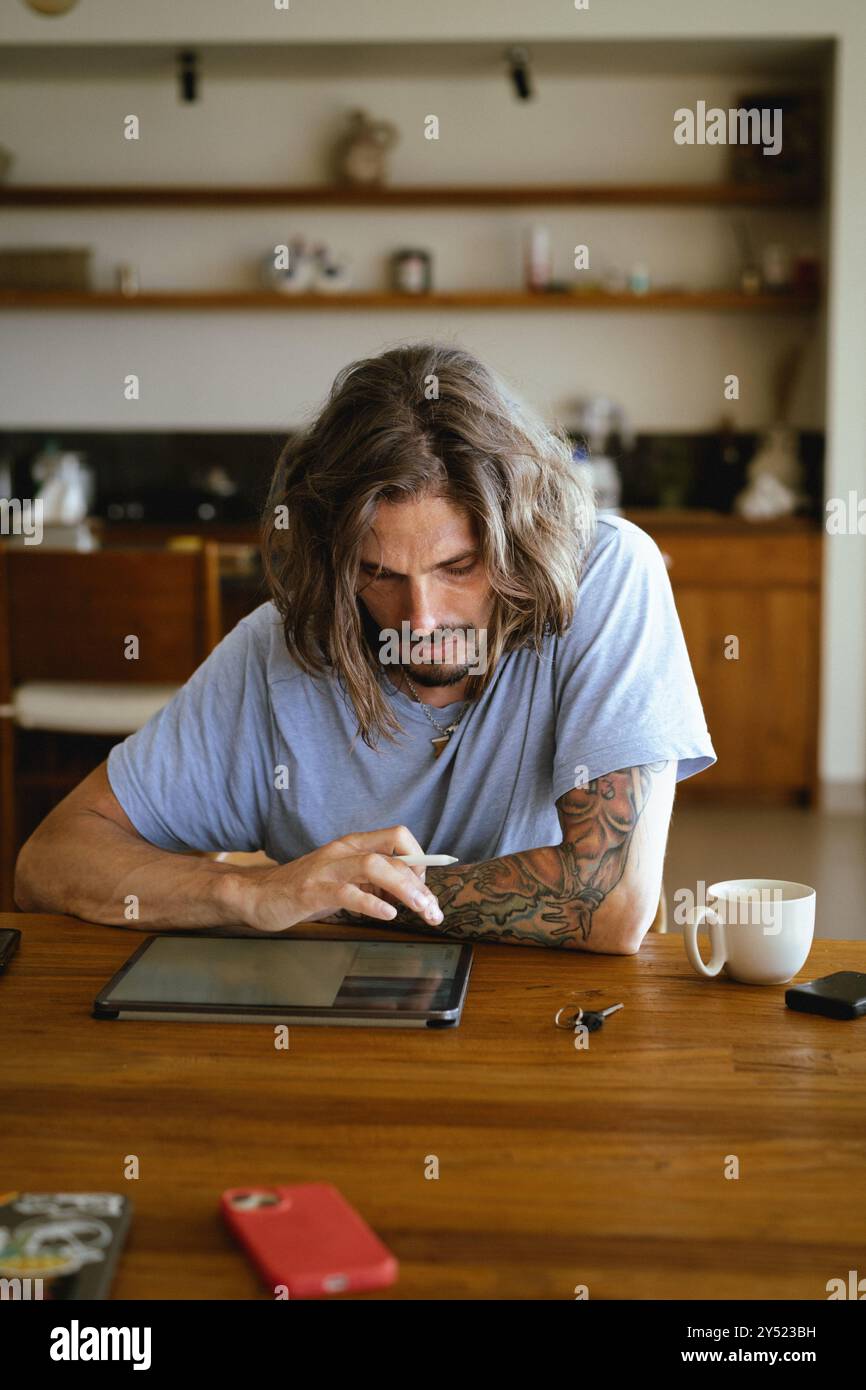 Man using tablet computer for work. Stock Photo