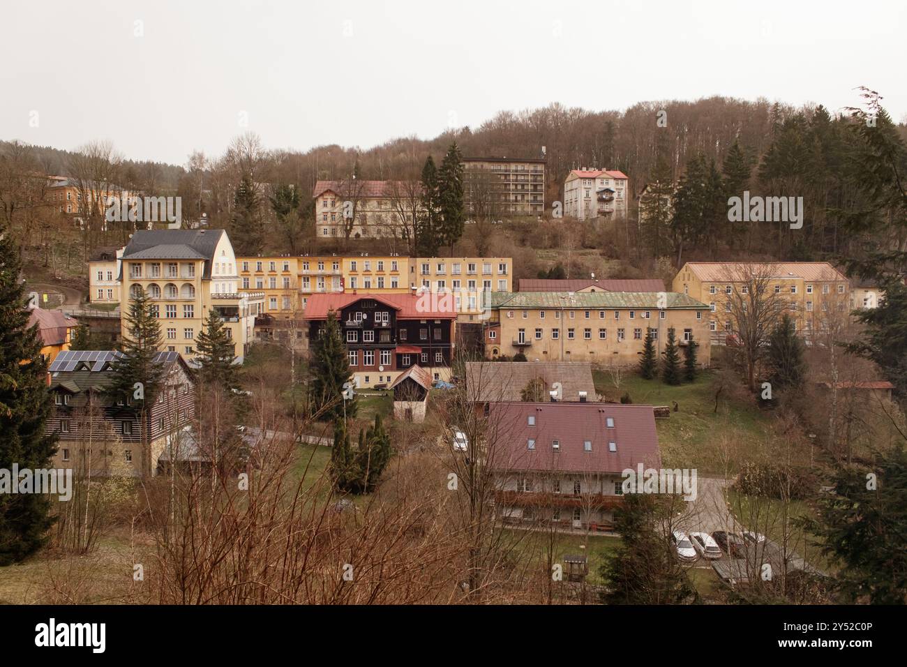 Picturesque european village nestled in a valley surrounded by forest ...