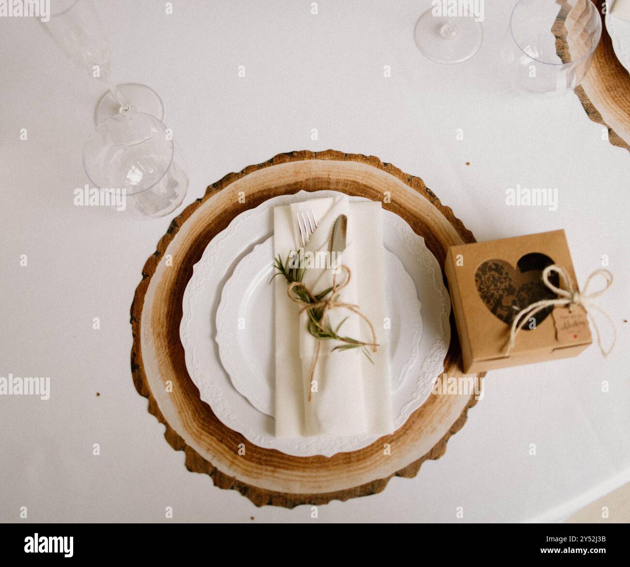 Rustic table setting with wood slice charger Stock Photo