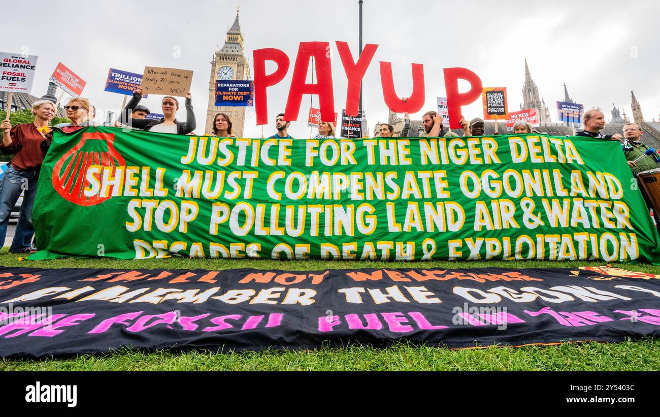 London, UK. 20 Sep 2024. Phase Out, Pay Up, Justice Now! A protest by the Climate Justice Coalition and War on want - They believe ‘Shell are responsible for driving climate change and silencing those who dare to speak out - not least in the Niger Delta. And are demanding that Shell PayUp for the damage they have caused and that Parliament commits to paying climate finance and an end to fossil fuels exploitation.' The coalition believes ‘The world has no more time to phase-out of fossil fuels and that the Global North is failing in delivering their climate finance obligations to the Global Sou Stock Photo