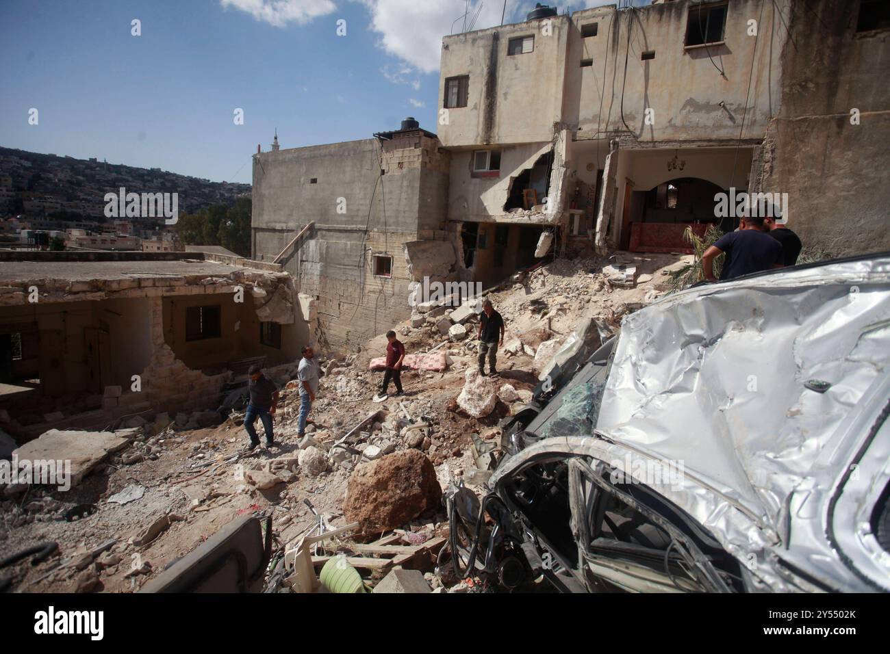 Jenin Checkpoint People check the destruction in the aftermath of an Israeli military ...