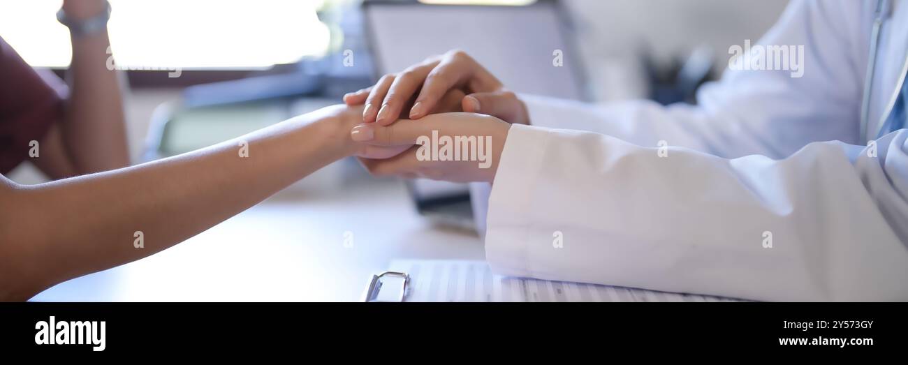 Asian psychologist women holding hand to encouraging patient and giving ...