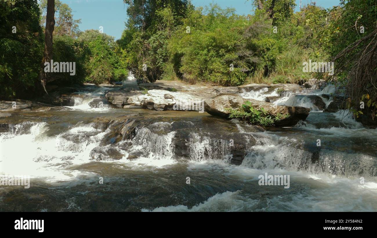Serene waterfall cascading through lush hi-res stock photography and ...