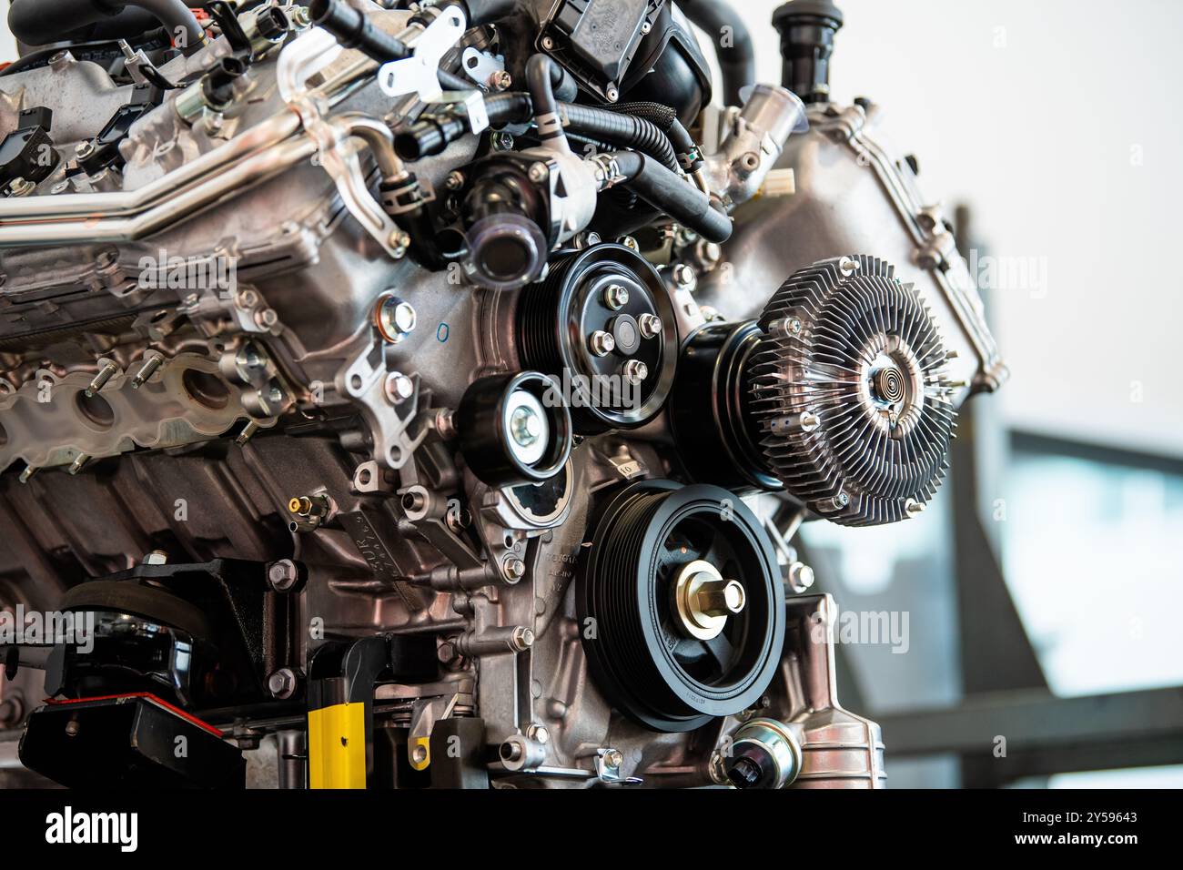 A deconstructed car engine at a mechanic's garage. Stock Photo