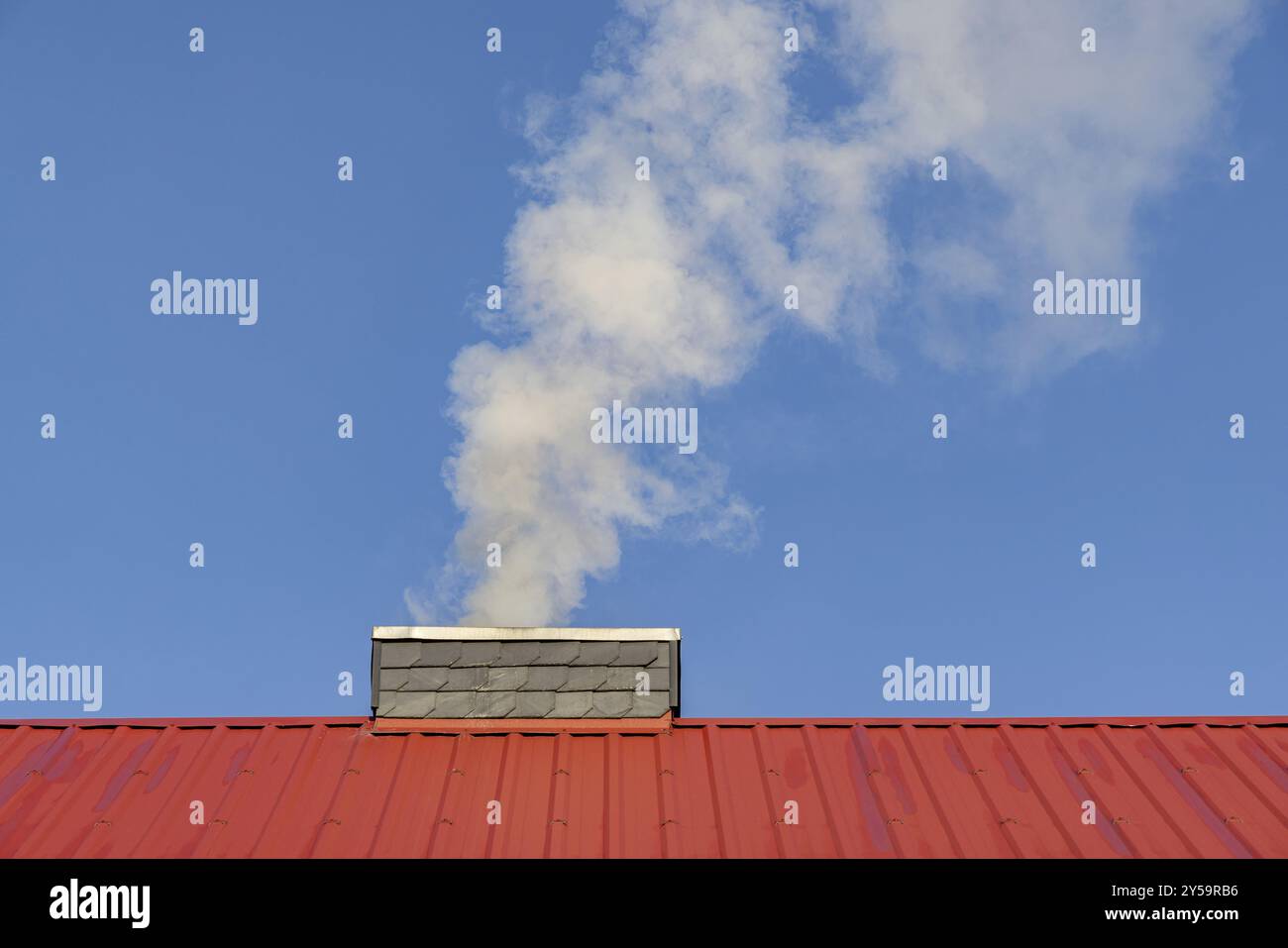 Environmental impact of heating smoke flue Stock Photo - Alamy