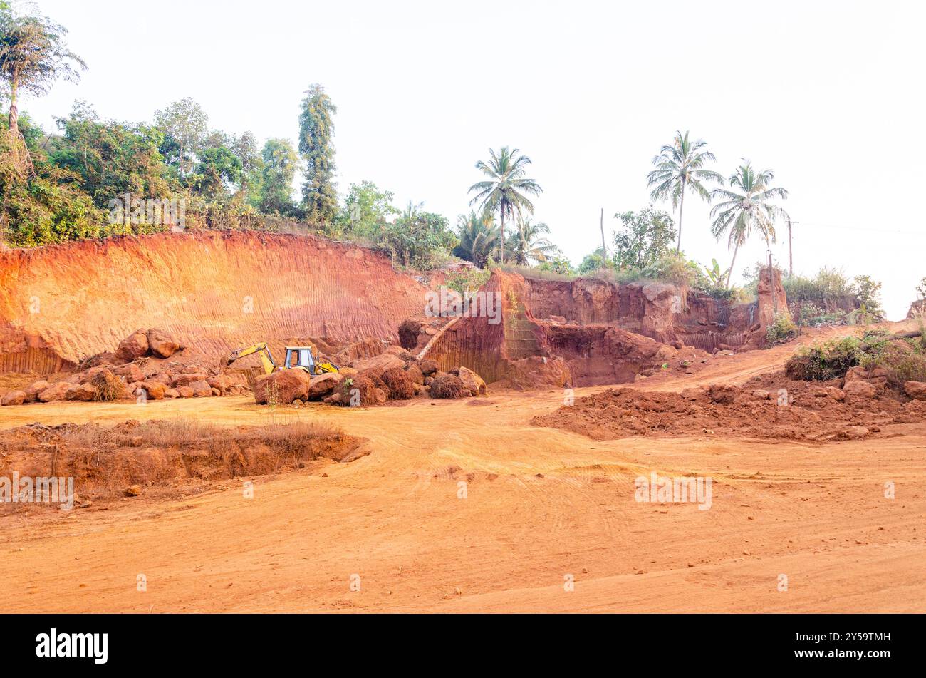 Earth moving and ground leveling work using heavy equipment at a ...