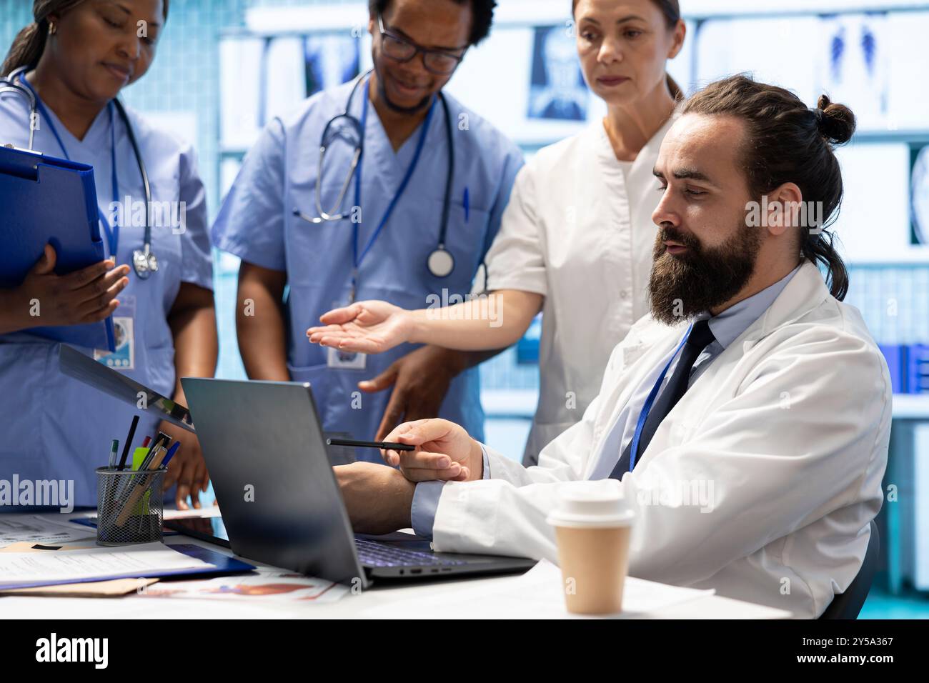 Medical team discussing treatment plans hi-res stock photography and ...
