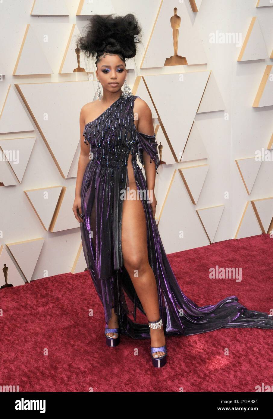 chloe bailey purple dress Celebs Love: LaQuan Smith's Purple $2,395 Suede Keyhole Twisted Gown is a Celeb Favorite Amognst Chloe Bailey, Fantasia, & Wendy Osefo