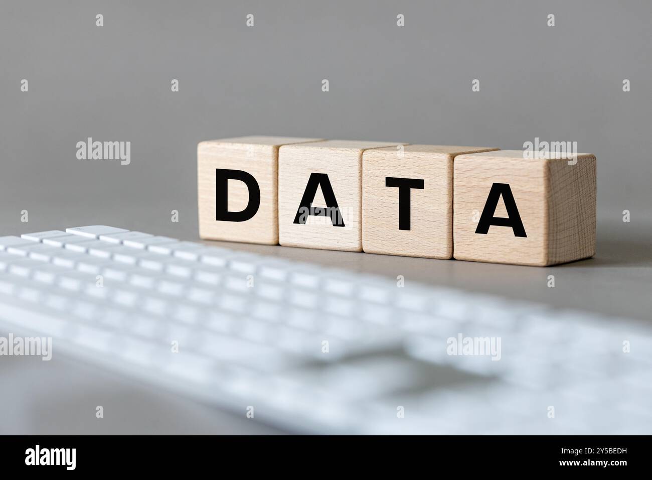 Data concept. The word DATA written on wooden cubes on a computer keyboard background. Data storage concept Stock Photo