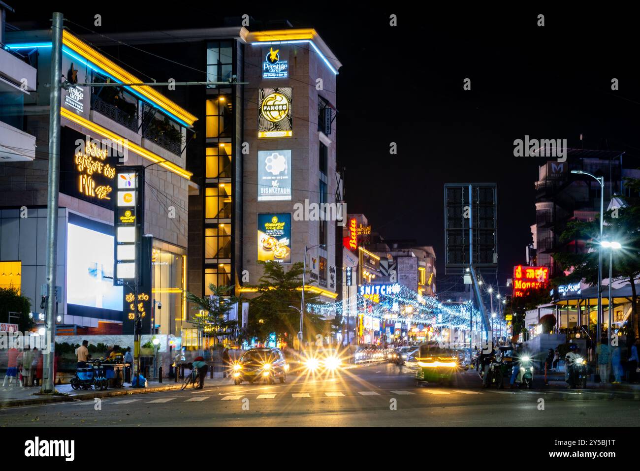 Brigade Road Bengaluru Karnataka India September 7 2024 Busy lit up streets and shops and buildings at Brigade Church Street and MG road in Bengaluru Stock Photo