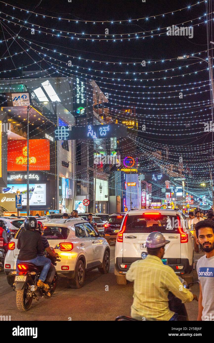 Brigade Road Bengaluru Karnataka India September 7 2024 Busy lit up streets and shops and buildings at Brigade Church Street and MG road in Bengaluru Stock Photo