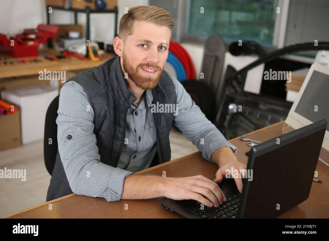 freelance developer smiling at camera Stock Photo