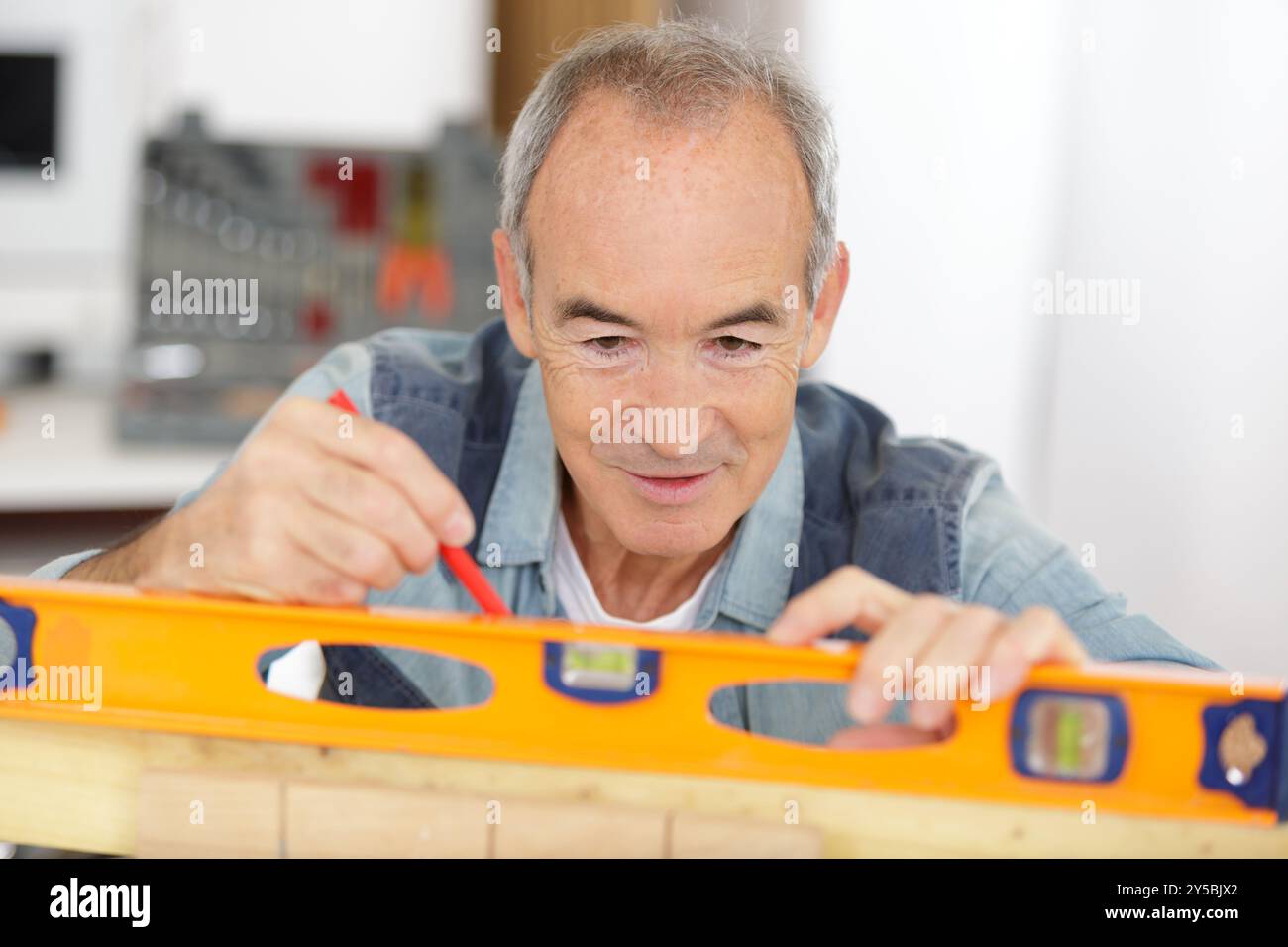 man working and checking level with contour Stock Photo