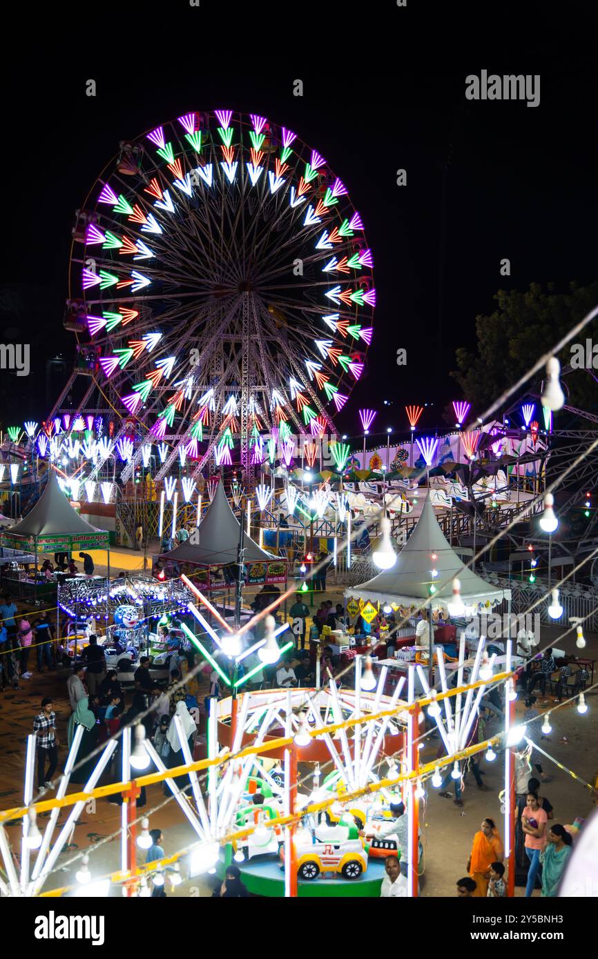 indian festival fair with different swings view from top at night video is taken at jodhpur local fair rajasthan india on Aug 19 2024. Stock Photo