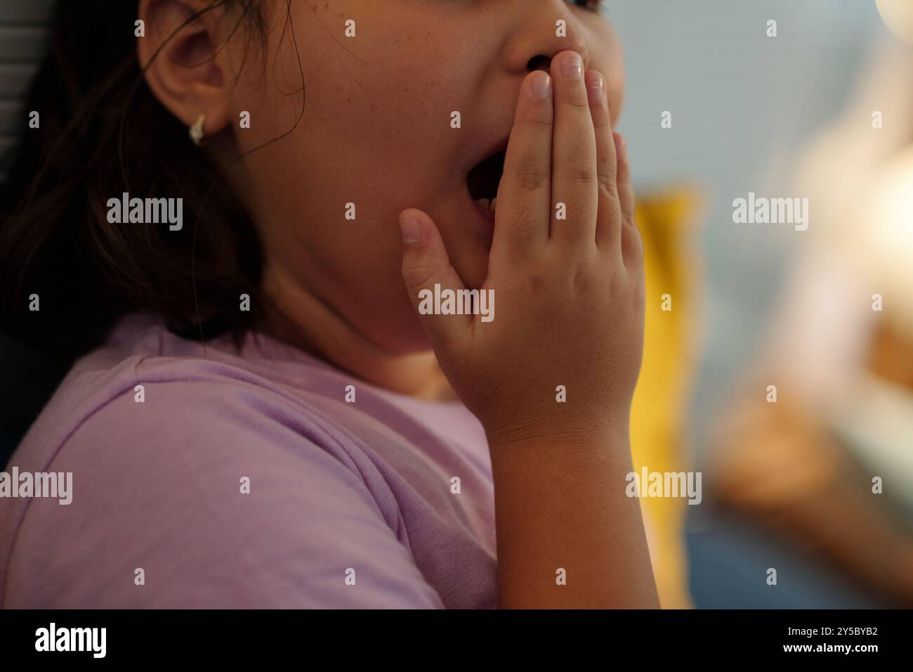 Little Girl Yawning Before Going To Bed Stock Photo - Alamy