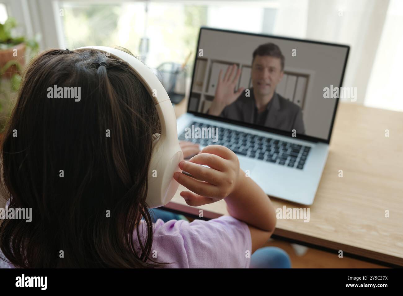 Schoolgirl Having Video Call With Teacher Stock Photo - Alamy