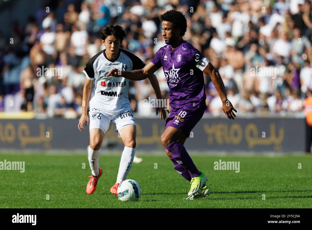 Antwerp, Belgium. 21st Sep, 2024. STVV's Rihito Yamamoto and Beerschot's Ryan Sanusi fight for the ball during a soccer match between Beerschot VA and STVV, in Antwerp, on the eight day of the 2024-2025 season of the 'Jupiler Pro League' first division of the Belgian championship, Saturday 21 September 2024. BELGA PHOTO KURT DESPLENTER Credit: Belga News Agency/Alamy Live News Stock Photo